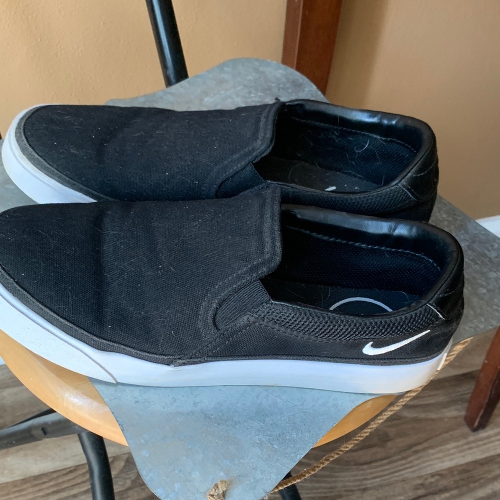 Nike womens Black and White Slip-On Sneakers